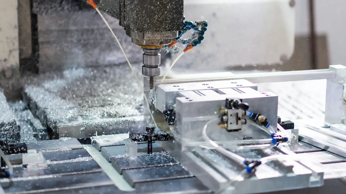 CNC milling machine machining a precision metal component
